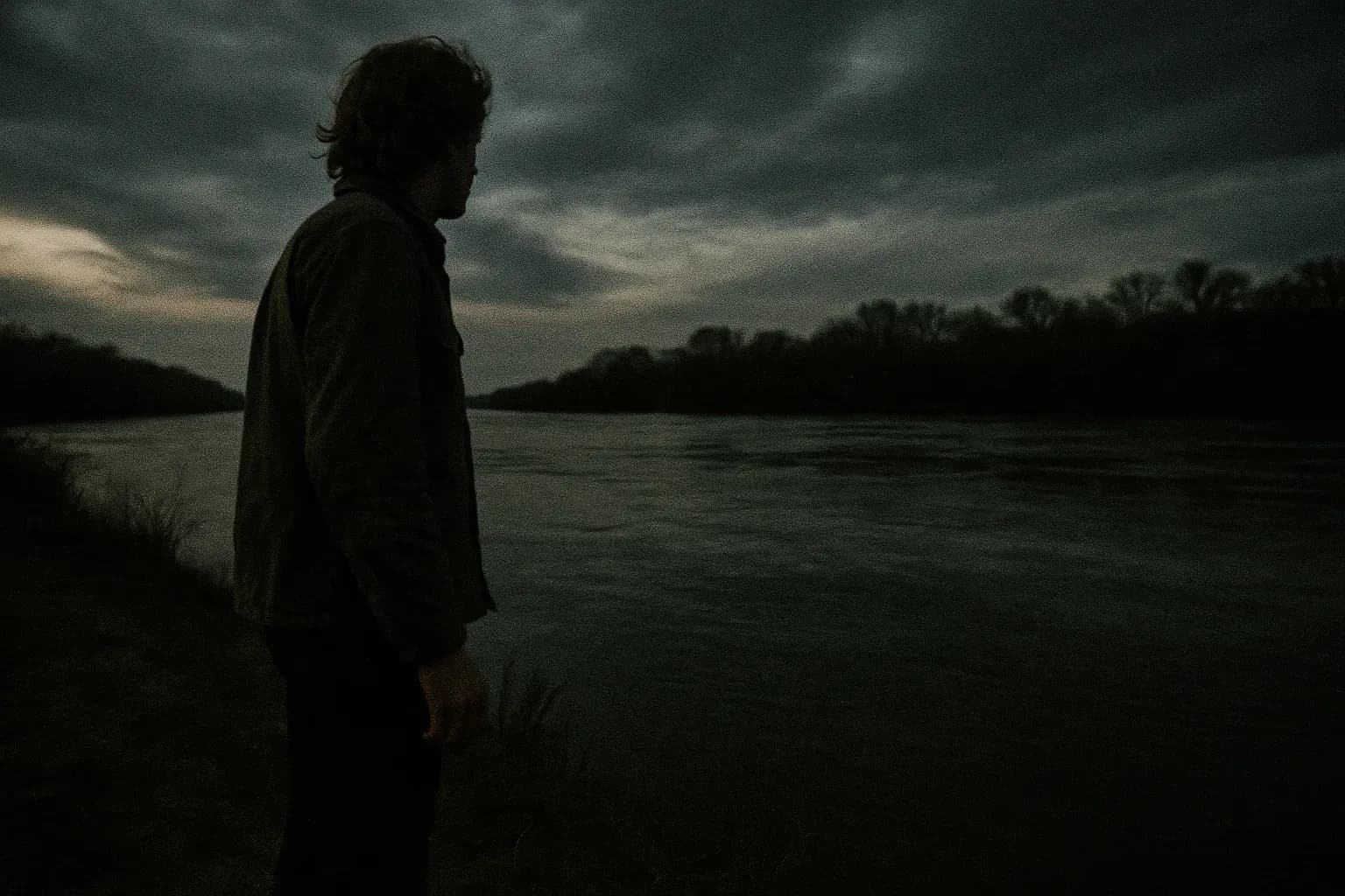 A figure resembling Billy Hayes stands beside the Evros River, looking towards Greece, symbolizing his daring escape from Turkey in 1975.